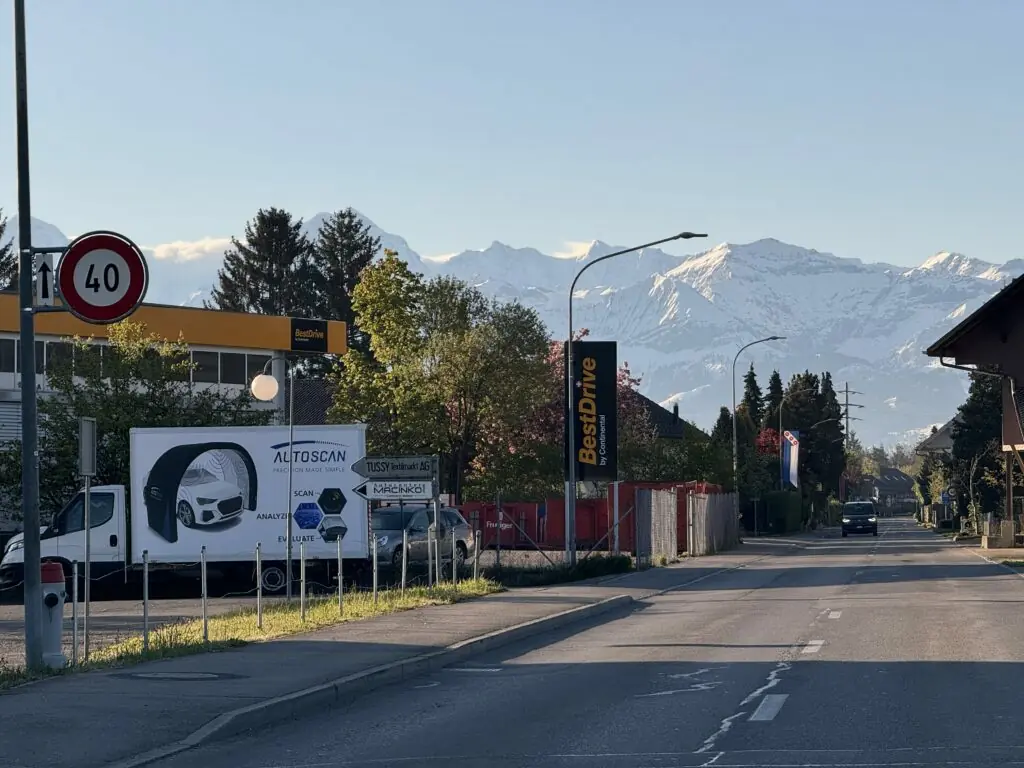 Autoscan truck for transportation in front, a mountain in the background